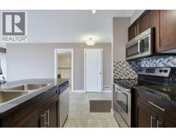 Laundry room - 1438, 81 Legacy Boulevard Se, Calgary, AB T2X2B9 Photo 8