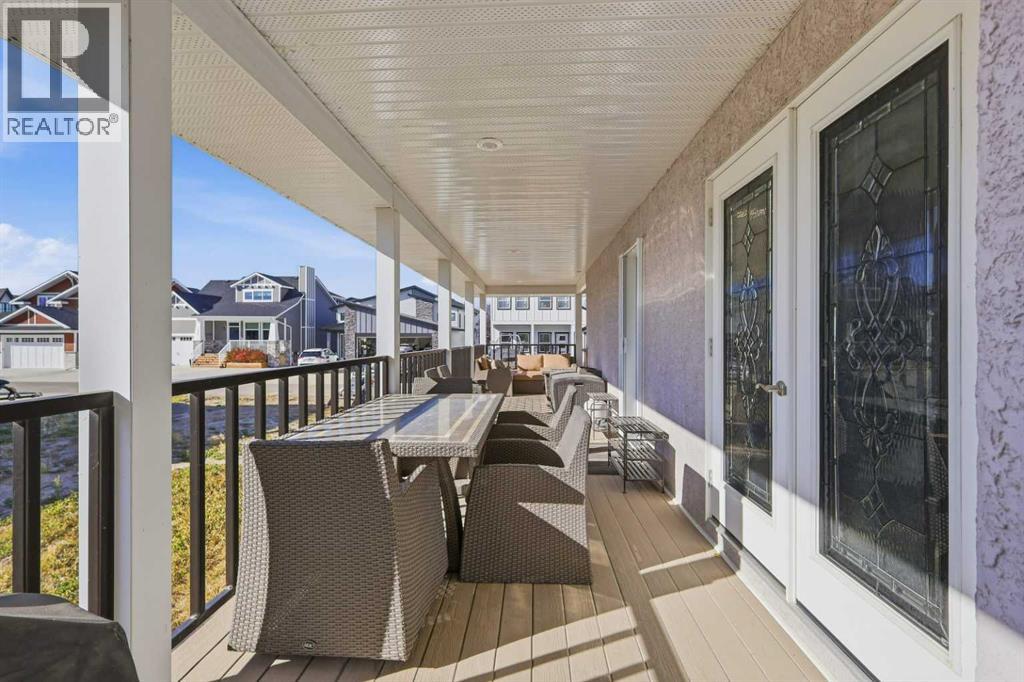 The covered deck offers plenty of room for outdoor dining and entertaining