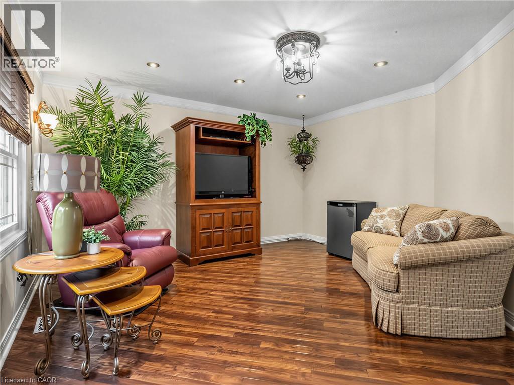2nd bedroom Wood-finish flooring throughout, complemented by crown molding and recessed lighting