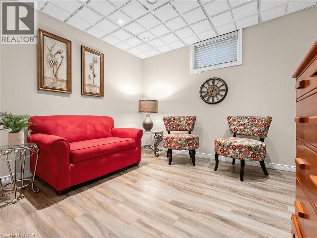 4th bedroom - basement - Recessed lighting, drop ceiling, wood-finish flooring, and a single window