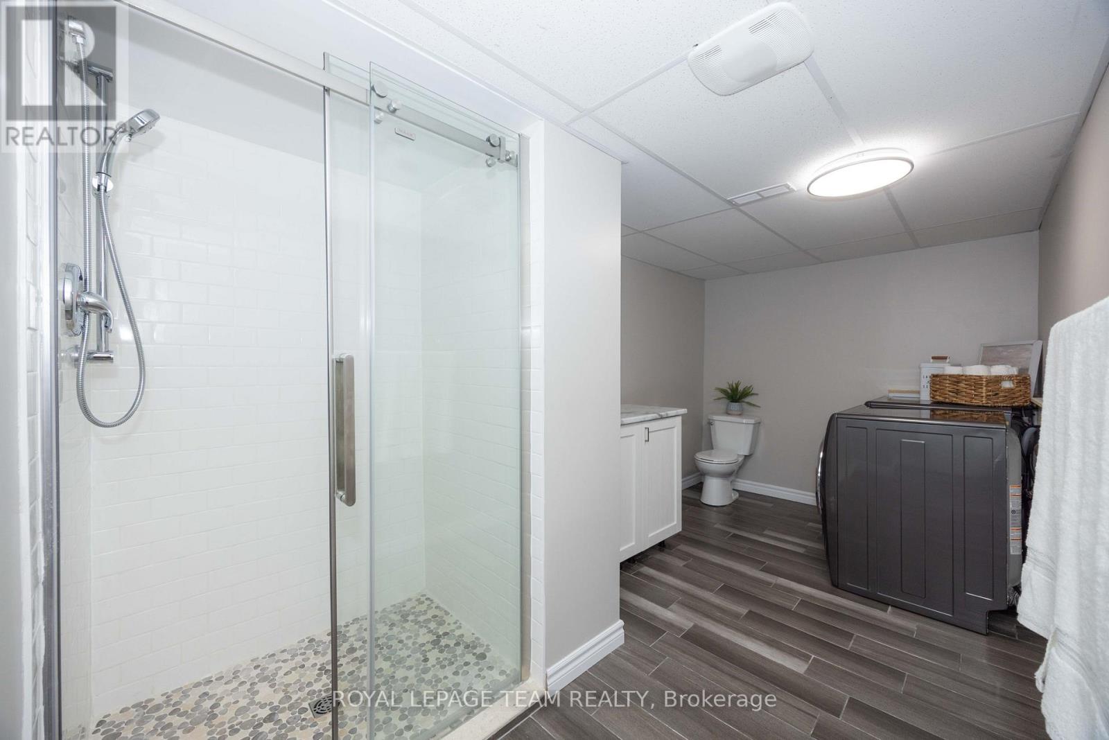 Spacious laundry room with a 3-piece bathroom