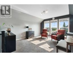 Family room - 202 Boulder Creek Court Se, Langdon, AB T0J1X3 Photo 13