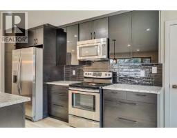 Kitchen - 47 Midvalley Rise Se, Calgary, AB T2X1J3 Photo 11
