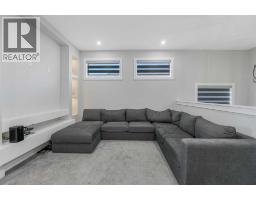 Family room - 58 Creekside Avenue Sw, Calgary, AB T2X4A9 Photo 21