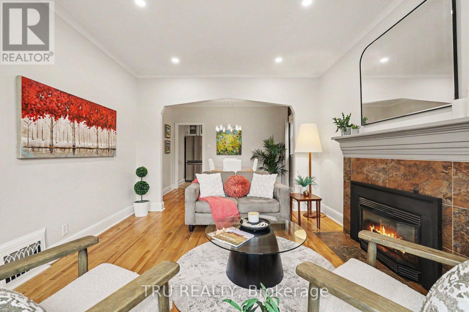 Bright inviting living room opens to dining room