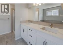 Laundry room - 112 Emberside Place, Cochrane, AB T4C3A8 Photo 12