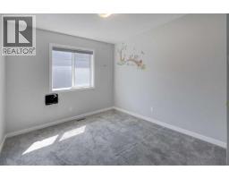 Laundry room - 112 Emberside Place, Cochrane, AB T4C3A8 Photo 16