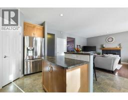 Family room - 716 Boulder Creek Drive Se, Langdon, AB T0J1X3 Photo 12