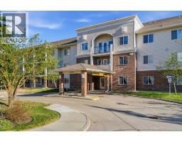 2102, 928 Arbour Lake Road NW - photo 1