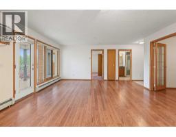 Primary Bedroom - 220, 7229 Sierra Morena Boulevard Sw, Calgary, AB T3H3L8 Photo 6