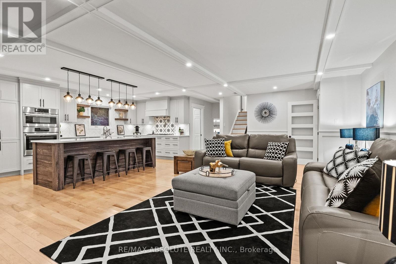Main floor living room open to kitchen