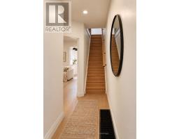 Bedroom with bed, closets, window, and wood-look floor - 54 Thyra Avenue Toronto
