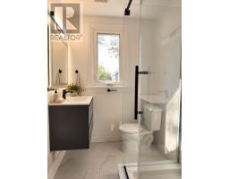 Bedroom with light pink walls and hardwood floors - 54 Thyra Avenue Toronto