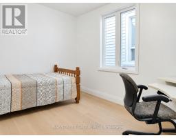 Hallway with laminate flooring and staircase - 54 Thyra Avenue Toronto