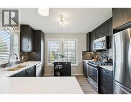 Bedroom - 100, 50 Westland Road, Okotoks, AB T1S2G4 Photo 10