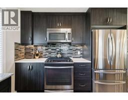 2pc Bathroom - 100, 50 Westland Road, Okotoks, AB T1S2G4 Photo 12