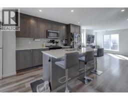 Primary Bedroom - 319, 260 Rowley Way Nw, Calgary, AB T3L0H5 Photo 6