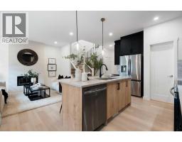 Family room - 91 Heritage Manor, Cochrane, AB T4C3K8 Photo 11