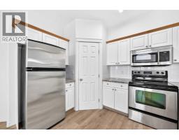 Living room - 1315, 7451 Springbank Boulevard Sw, Calgary, AB T3H4K5 Photo 6