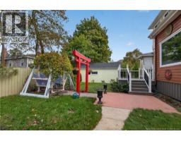 Rear view of property and backyard