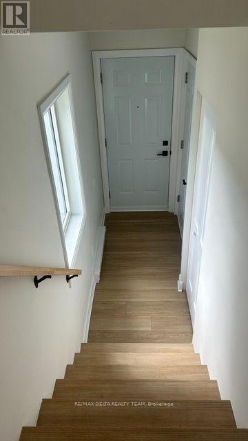 Front entrance with access to garage