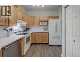 Kitchen - 102, 39 Hidden Creek Place Nw, Calgary, AB T3A6B9 Photo 6