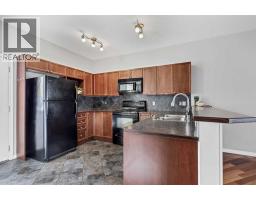 Family room - 101, 703 Luxstone Square Sw, Airdrie, AB T4B0A3 Photo 6