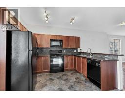 Primary Bedroom - 101, 703 Luxstone Square Sw, Airdrie, AB T4B0A3 Photo 8