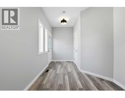 Living room - 5240 & 5242 51 Street, Lacombe, AB T4L1H7 Photo 11