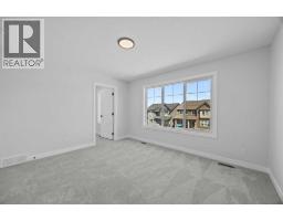 Bedroom - 35 Creekside Rise Sw, Calgary, AB T3X5V9 Photo 9