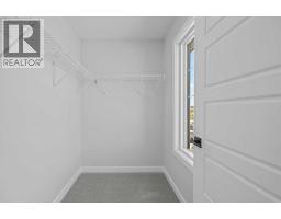 Family room - 35 Creekside Rise Sw, Calgary, AB T3X5V9 Photo 11