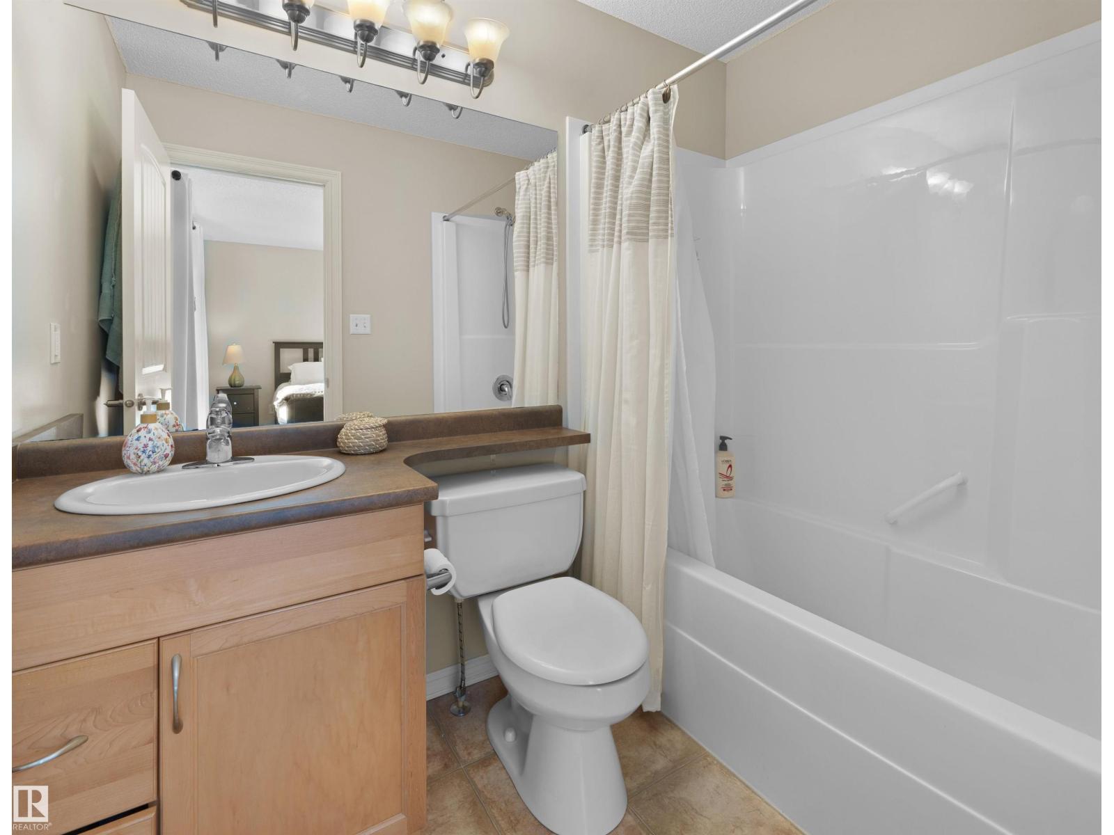 1175 36 Avenue NW, Tamarack — photo 17 of 30: Property photo