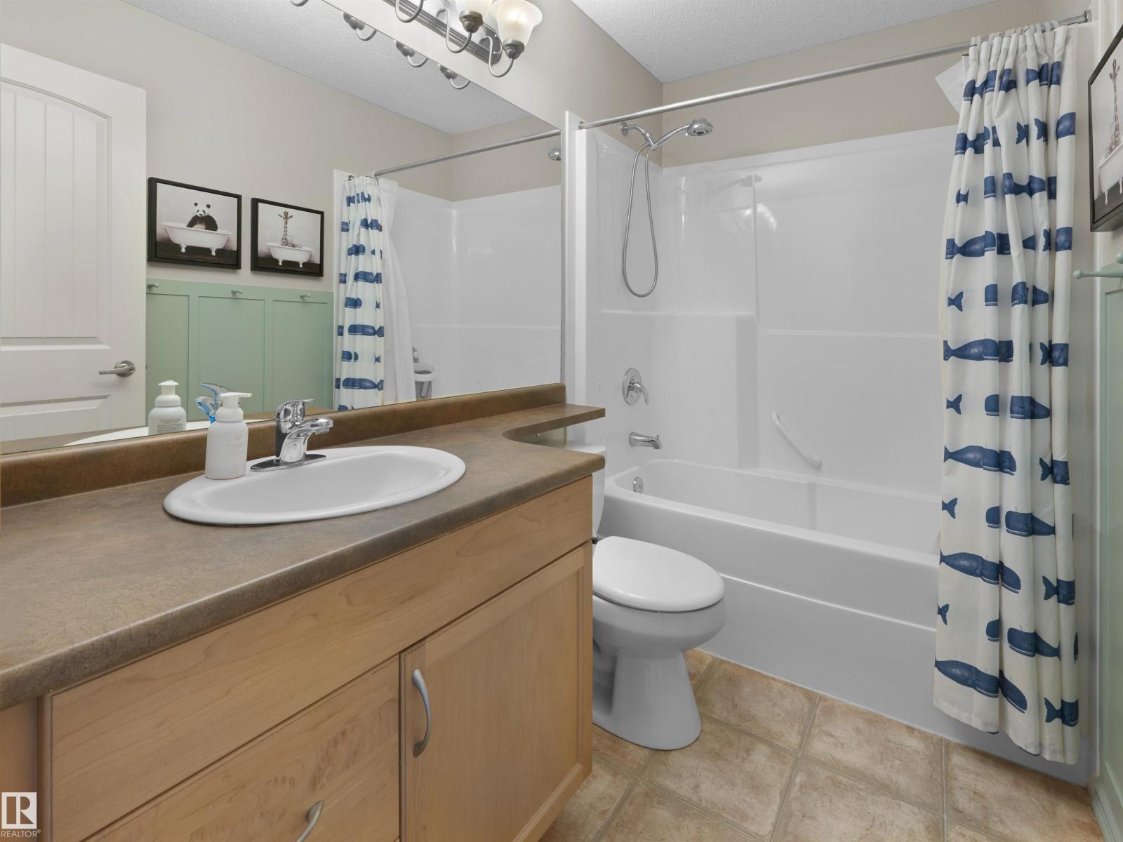 1175 36 Avenue NW, Tamarack — photo 20 of 30: Property photo