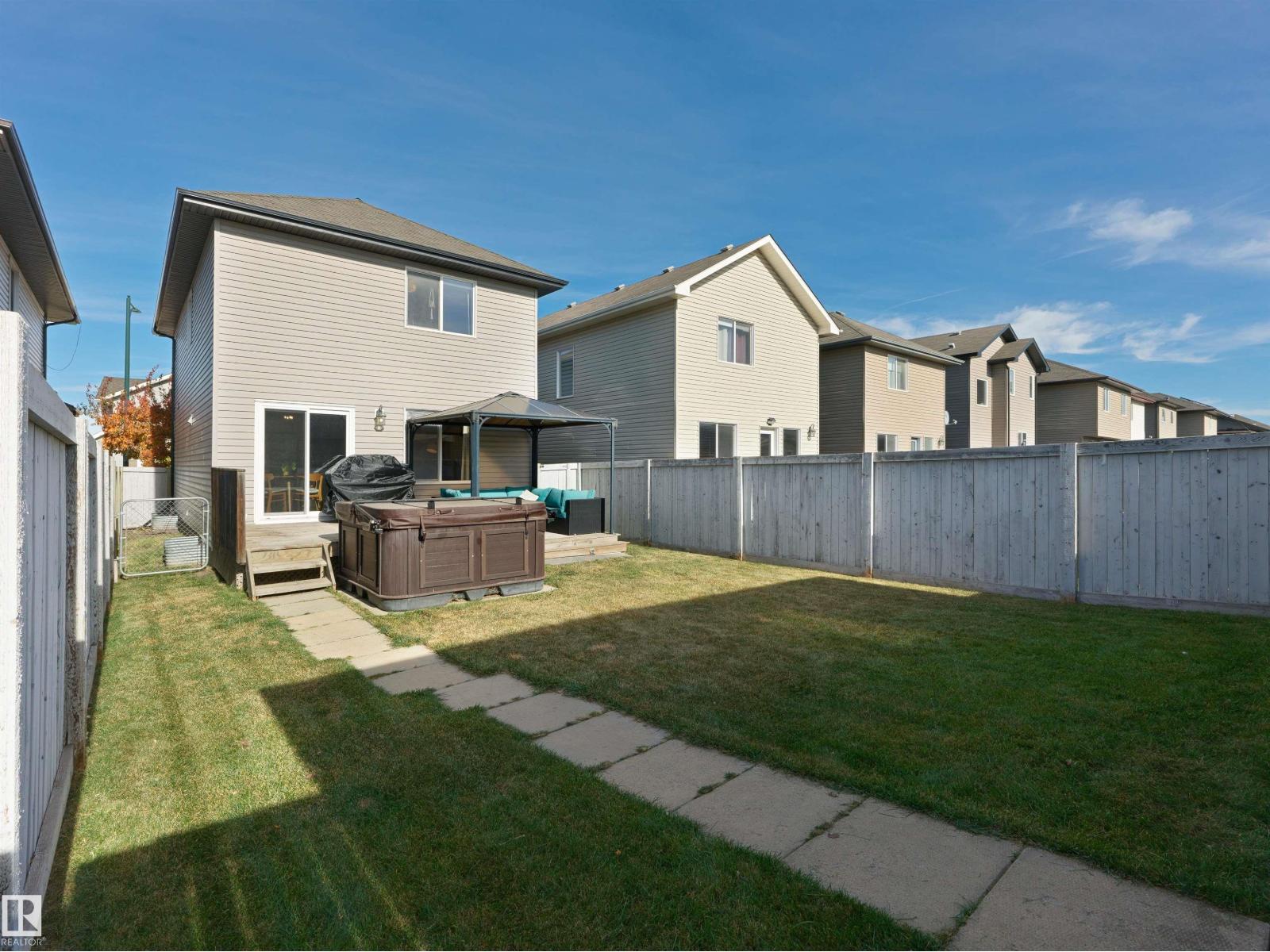 1175 36 Avenue NW, Tamarack — photo 28 of 30: Property photo