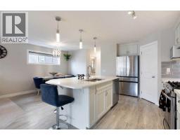 Laundry room - 7 Emberside Hollow, Cochrane, AB T4C2L6 Photo 7