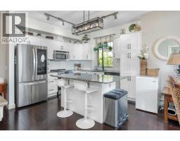 Living room - 320, 205 Sunset Drive, Cochrane, AB T4C0H6 Photo 6