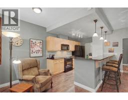 Den - 104, 140 Stonecreek Road, Canmore, AB T1W3J3 Photo 8