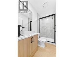 Bedroom - 911 Penmeadows Road Se, Calgary, AB T2H3R1 Photo 16