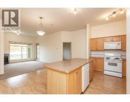 Living room - 105, 4425 Heritage Way, Lacombe, AB T4L2P4 Photo 7
