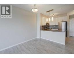Primary Bedroom - 307, 207 Sunset Drive, Cochrane, AB T4C0H7 Photo 10