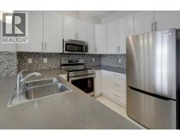 Kitchen - 307, 207 Sunset Drive, Cochrane, AB T4C0H7 Photo 6
