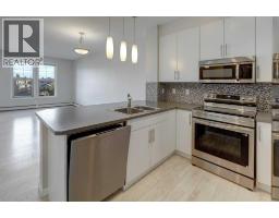 Living room - 307, 207 Sunset Drive, Cochrane, AB T4C0H7 Photo 8
