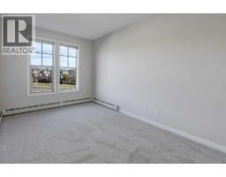 307, 207 Sunset Drive, Cochrane, AB T4C0H7 Photo 16