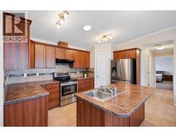 Living room - 98, 15 Mackenzie Ranch Way, Lacombe, AB T4L0B4 Photo 10