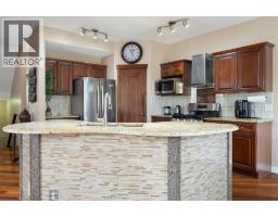 Family room - 86 Tuscany Ravine Road Nw, Calgary, AB T3L2R9 Photo 12
