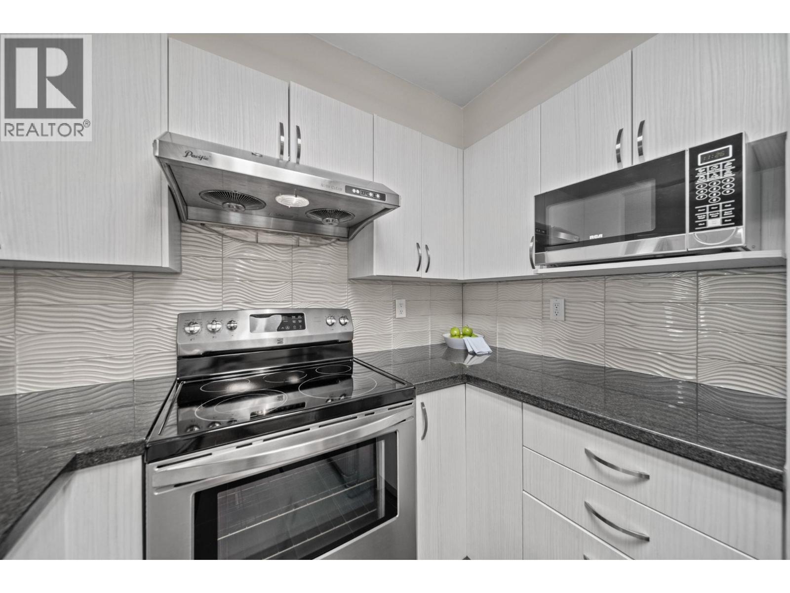 Photo of 302 6745 STATION HILL COURT 10