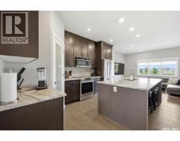 Family room - 105 542 Pringle Crescent, Saskatoon, SK S7T0W9 Photo 7
