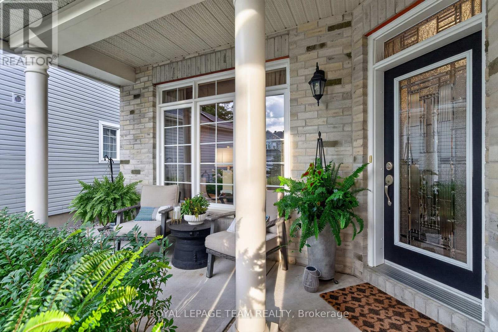 Covered front porch for seating and glass door