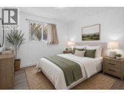 Bedroom - 100, 2519 38 Street Ne, Calgary, AB T1Y4W8 Photo 6