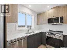 Laundry room - 279 Mark Bend, Saskatoon, SK S7V2B8 Photo 10